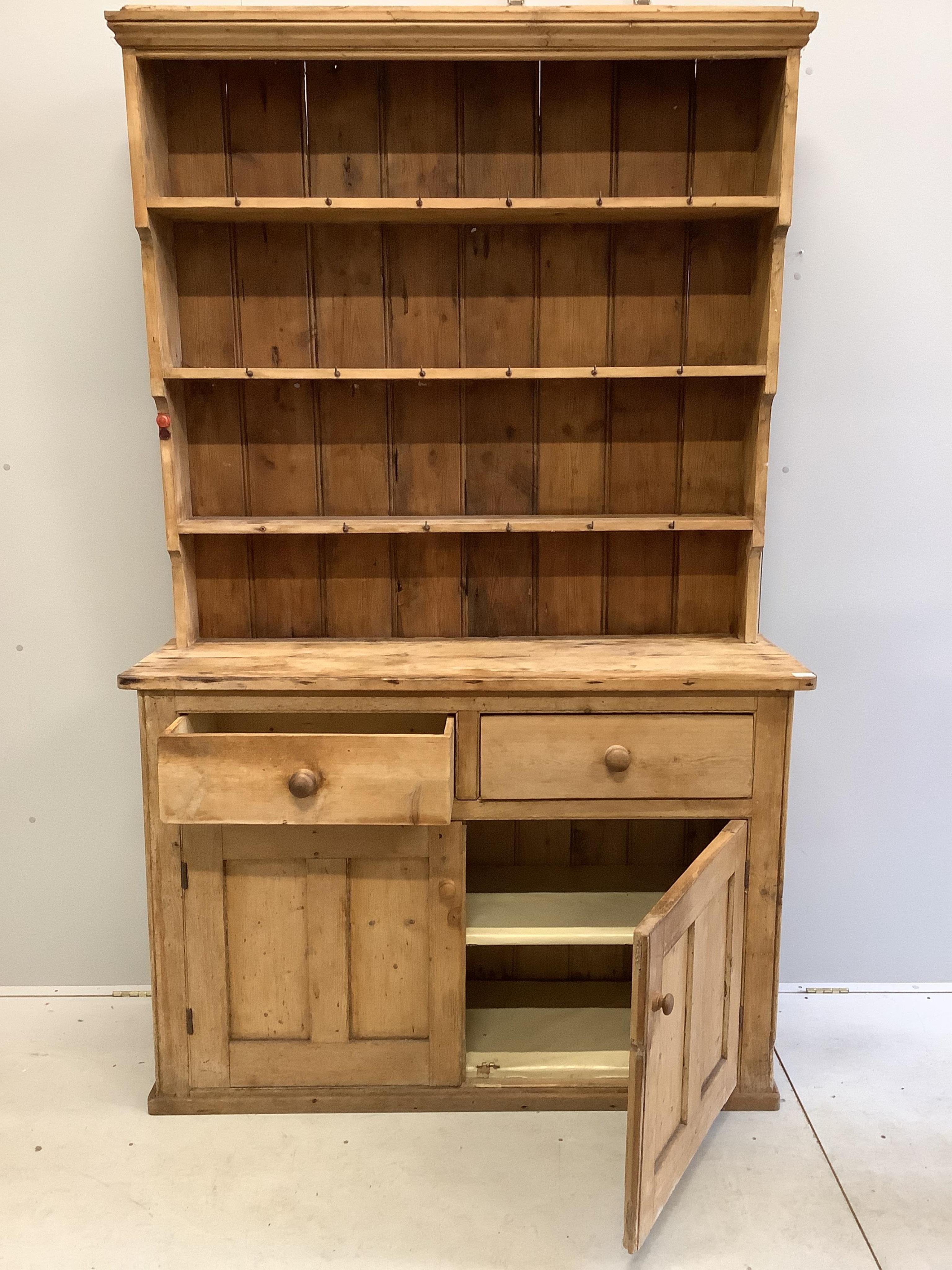 A Victorian pine dresser with boarded rack, width 140cm, depth 46cm, height 223cm. Condition - poor